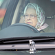 Her Royal Highness Queen Elizabeth II driving her Range Rover, with signature Labrador hood ornament, at the Royal Windsor Horse Show in May 2017.